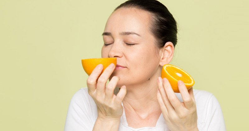 Woman Smelling a Lemon | Anosmia