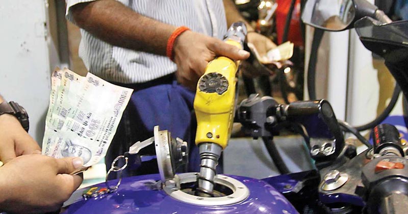 A person getting fuel filled in his bike | Future Call on Rise in Fuel Price India