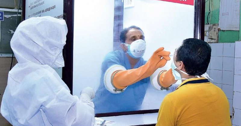 A person undergoing Covid test in Kerala | Rise in Covid Cases Kerala