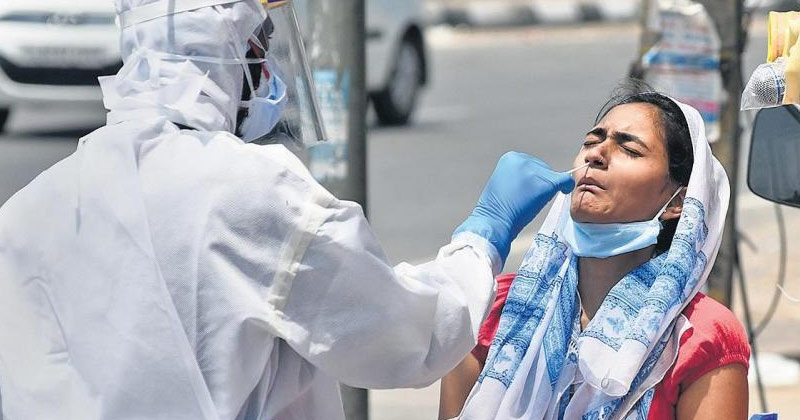 Health Worker Collection Covid Sample of a Woman | Covid Restrictions in Delhi