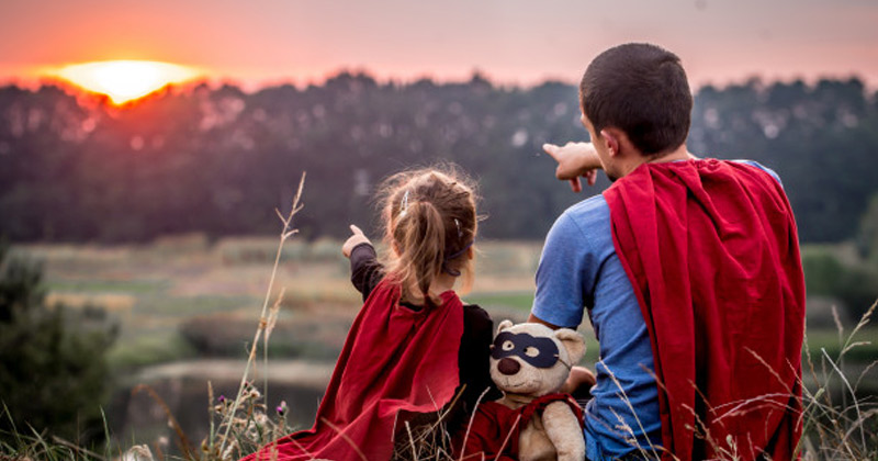 Father and Daughter Wearing Super hero costume and staring at sun | Zodiac Signs As Dads