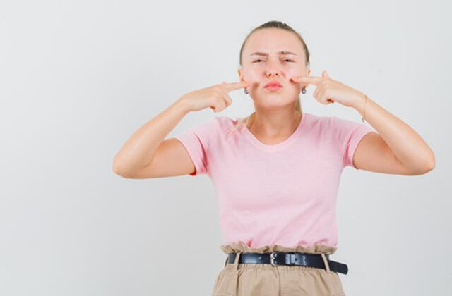 Woman Pointing at her upper lip | How to Remove Upper Lip Hair At Home